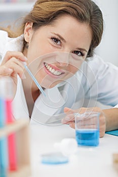 woman in lab with pipettes photo
