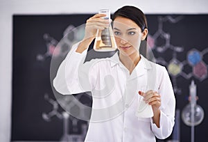 Woman, laboratory and science experiment with beakers for medical investigation as research, solution or futuristic