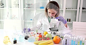 A woman in the laboratory tests fruits and vegetables
