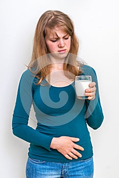 Woman with lactose problem is suffering from stomach pain