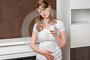 Woman with lactose problem is suffering from stomach pain