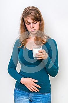 Woman with lactose problem is suffering from stomach pain