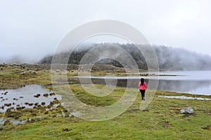 Woman at the Laguna de Mucubaji lake in Merida, Venezuela