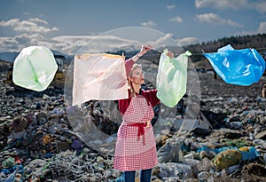 Woman on landfill, consumerism versus plastic pollution concept.