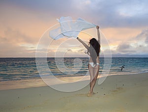 Woman on lanikai beach at sunrise