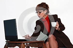 Woman with lap top and coffee