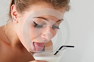 Woman lapping milk