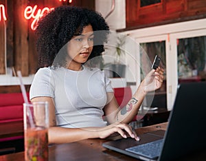 Woman, laptop and credit card for banking payment in a cafe or restaurant with fintech. Pc, coffee shop and female