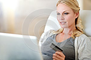 Woman, laptop and credit card for ecommerce, payment or electronic purchase in living room at home. Female person or
