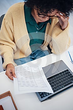 Woman, laptop and documents in debt, financial crisis or mistake with expenses, bills or invoice at home. Female person