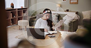 Woman, laptop and doubt for paperwork in home, budget and accountant for audit information. Female person, online tax