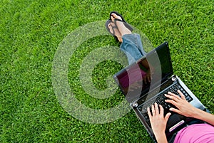 Woman laptop grass