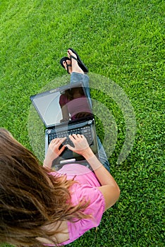 Woman laptop grass