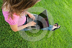 Woman laptop grass