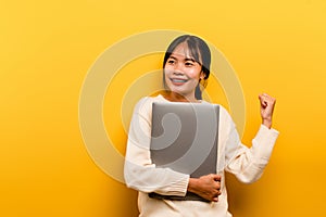 woman and laptop and are happy to work Photo of a beautiful Asian woman who is happy working at home. using a laptop