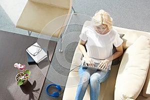 Woman with laptop at home