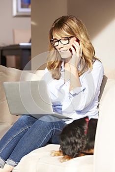 Woman with laptop at home