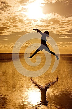 Woman with Laptop Jumping Around