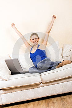 Woman with a laptop on a lounge photo