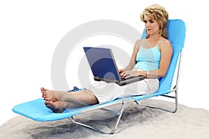 Woman On Laptop In Lounge Chair