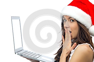 Woman with laptop notebook in christmas hat