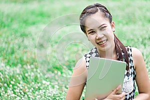 Woman on laptop outside