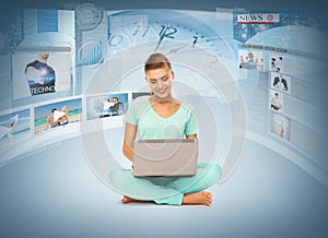 Woman with laptop pc and virtual screens