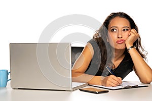Woman with laptop and pencile
