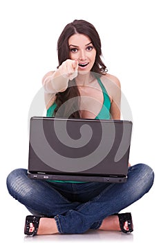 Woman with laptop pointing