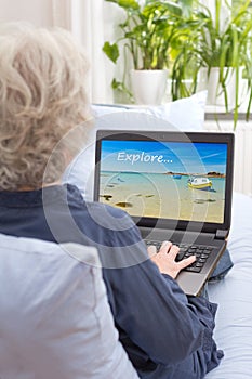 Woman laptop searching holiday trip