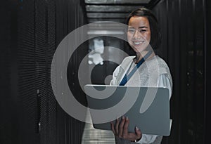 Woman with laptop, server room and information technology, smile in portrait with engineer and datacenter Software