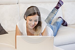 Woman laptop sofa