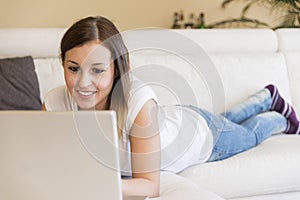 Woman laptop sofa