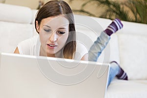 Woman laptop sofa