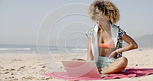 Woman With Laptop On The Summer Beach