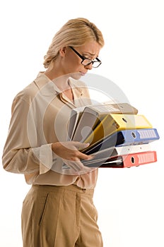 Woman with large pile of binders