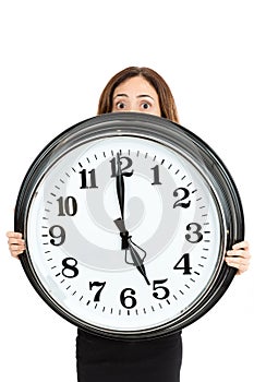 Woman late and showing the time with shocked eyes