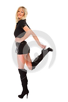 Woman in latex with handcuffs on white