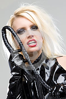 woman in latex with whip photo
