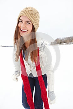 Woman, laugh and clothes outdoor in snow, winter fashion and designer jersey or season outfit. Female person, humor and