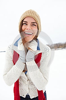 Woman, laugh and style in outdoor snow, warm clothes and designer jersey or season outfit. Comic female person, humor