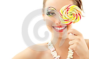 Woman laughing with candy and beautiful make-up young attractive