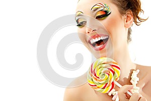 Woman laughing with candy and beautiful make-up young attractive