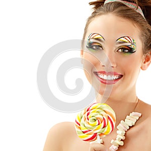 Woman laughing with candy and beautiful make-up young attractive