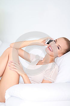 Woman laughing with friends over a mobile