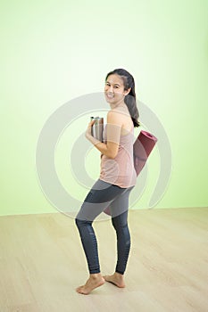 Woman laughing happily in yoga studio