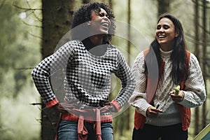 Woman laughing during a hike with friends