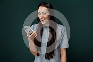 Woman Laughing Holding Cell Phone