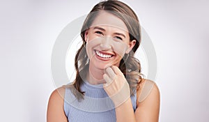 Woman, laughing and portrait in white studio background with confidence for student, college or university in Canada