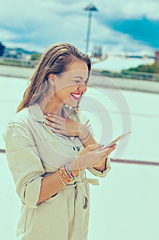 Woman laughing on social media meme outdoors photo